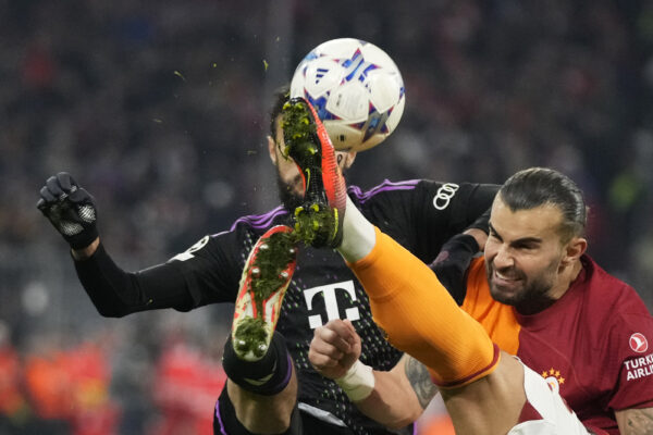 <b>MUNICH — Closeup of cleats shows the power of a high kick:</b> Bayern's Noussair Mazraoui, left, and Galatasaray's Abdulkerim Bardakci challenge for the ball during the Champions League group A soccer match between Bayer Munich and Galatasaray at the Allianz Arena stadium in Munich, Germany, Wednesday, Nov. 8, 2023.<br>Photo: Matthias Schrader/AP