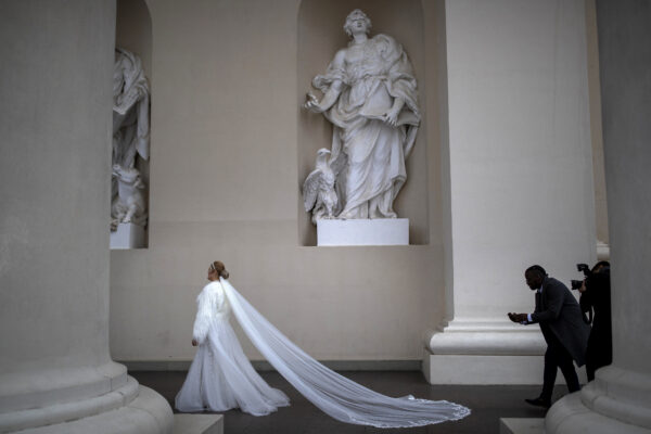 LITHUANIA — Dramatic moment in public space where a bride’s train attracts photographers: A bride poses for a photograph at the Cathedral Square in Vilnius, Lithuania, Saturday, Nov. 11, 2023.<br>Photo: Mindaugas Kulbis/AP