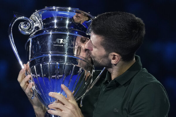 TURIN — Lots of kisses and he never needs to tell, the press does that: Serbia's Novak Djokovic kisses the trophy as ATP world best player at the ATP World Tour Finals, at the Pala Alpitour, in Turin, Italy, Monday, Nov. 13, 2023. Djokovic was presented with the trophy for finishing the year ranked No. 1.<br>Photo: Antonio Calanni/AP