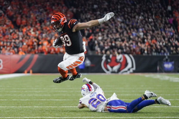 CINCINNATI — Diving and leaping, part of a game where flying helps: Cincinnati Bengals tight end Drew Sample, top, leaps over the tackle attempt of Buffalo Bills safety Taylor Rapp before scoring on a touchdown catch and run during the first half of an NFL football game, Sunday, Nov. 5, 2023, in Cincinnati. Photo: Darron Cummings/AP