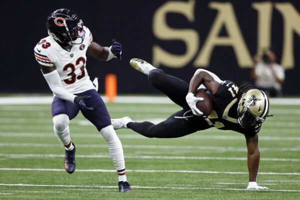 NEW ORLEANS — ‘Don’t mess with the man doing a handstand.’:  New Orleans Saints running back Alvin Kamara (41) makes a catch next to Chicago Bears cornerback Jaylon Johnson (33) during the first half of an NFL football game in New Orleans, Sunday, Nov. 5, 2023. Photo: Butch Dill/AP