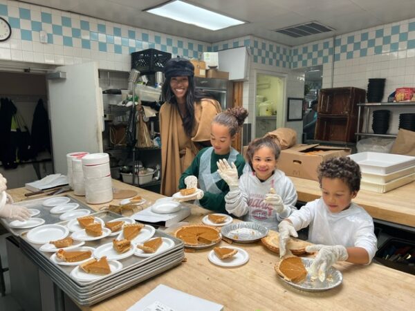 Volunteering from an early age: These youths enjoyed distributing the desserts at Coney Island Gospel Assembly Thanksgiving.Photo credit: Alliance for Coney Island