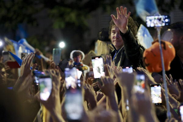 <b>ARGENTINA — Where the rubber meets the road in politics, greetings supporters face to face, hand to hand:</b> Javier Milei, Liberty Advances coalition presidential candidate, right, greets supporters during his closing campaign rally in Cordoba, Argentina, Thursday, Nov. 16, 2023. Milei will face Economy Minister Sergio Massa, the ruling party's candidate, in a runoff election on Nov. 19.<br>Photo: Nicolas Aguilera/AP