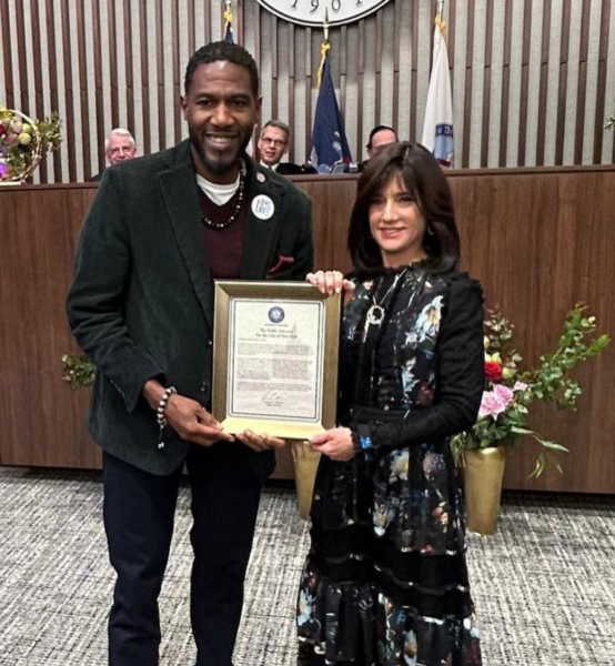 Public Advocate Jumaane Williams presents a citation to Justice Rachel Freier, commemorating her groundbreaking appointment to the NY Supreme Court.