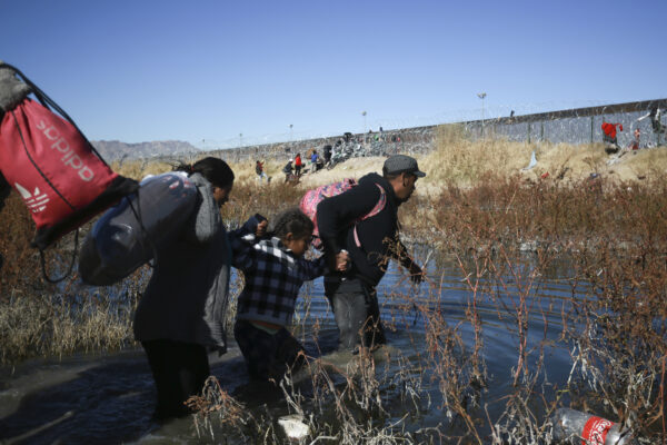 <b>RIO GRANDE RIVER — As the song says, ‘Once a day, every day, all day long’:</b> Migrants cross the Rio Grande River to reach the United States from Ciudad Juarez, Mexico, on Wednesday, Dec. 27, 2023.<br>Photo: Christian Chavez/AP