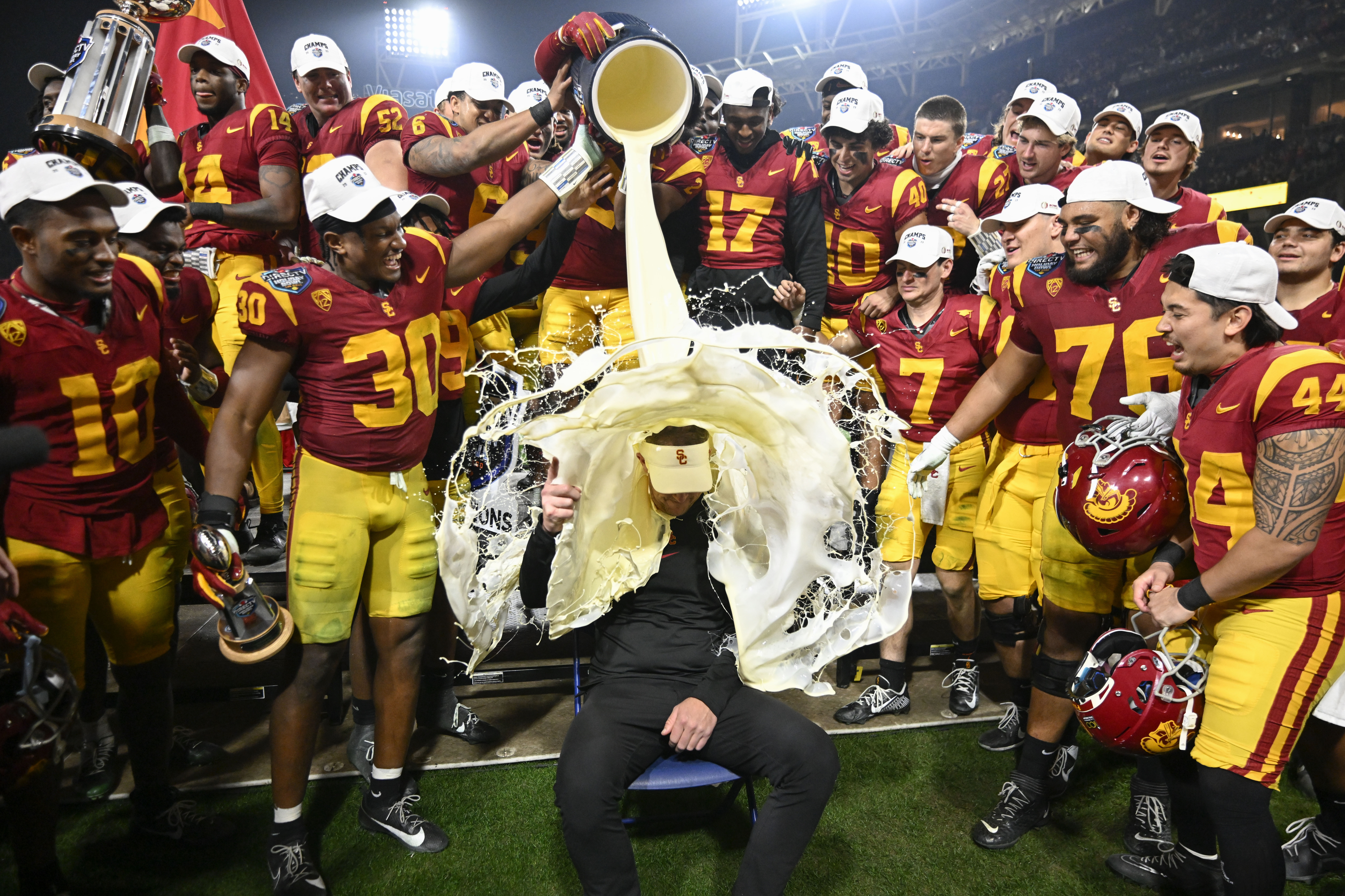 SAN DIEGO — EGGNOG??? Whatever happened to Gatorade? Southern California players pour eggnog onto coach Lincoln Riley after the team's 42-28 win over Louisville in the Holiday Bowl NCAA college football game Wednesday, Dec. 27, 2023, in San Diego.Photo: Denis Poroy/AP