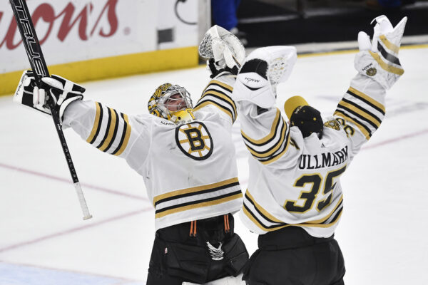 <b>BUFFALO — ‘Great arms think alike’... in unison:</b> Boston Bruins goalie Jeremy Swayman, left, celebrates with goalie Linus Ullmark after the team's win over the Buffalo Sabres in an NHL hockey game in Buffalo, N.Y., Wednesday, Dec. 27, 2023.<br>Photo: Adrian Kraus/AP