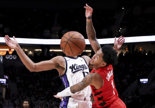 <b>PORTLAND — For a brief moment, any player can look like ‘Mr. Basketball Bubblehead’:</b> Portland Trail Blazers guard Anfernee Simons, right, knocks the ball loose from Sacramento Kings forward Keegan Murray during the second half of an NBA basketball game Tuesday, Dec. 26, 2023, in Portland, Ore.<br>Photo: Howard Lao/AP