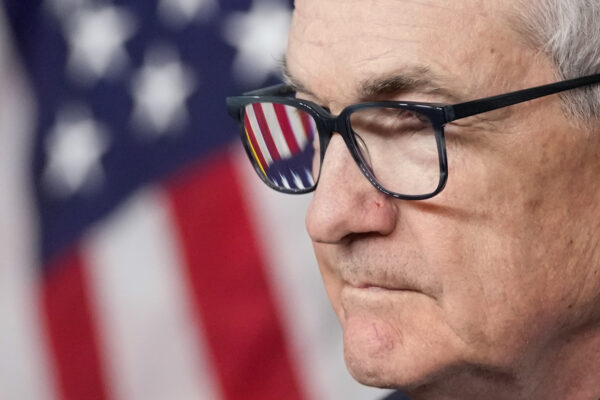 <b>WASHINGTON, D.C. — Interpreting an omen — ‘Let’s do what’s best for the U.S.’:</b> An American flag is seen in Federal Reserve Board Chair Jerome Powell's glasses as he speaks during a news conference about the Federal Reserve's monetary policy at the Federal Reserve, Wednesday, Dec. 13, 2023, in Washington.<br>Photo: Alex Brandon/AP