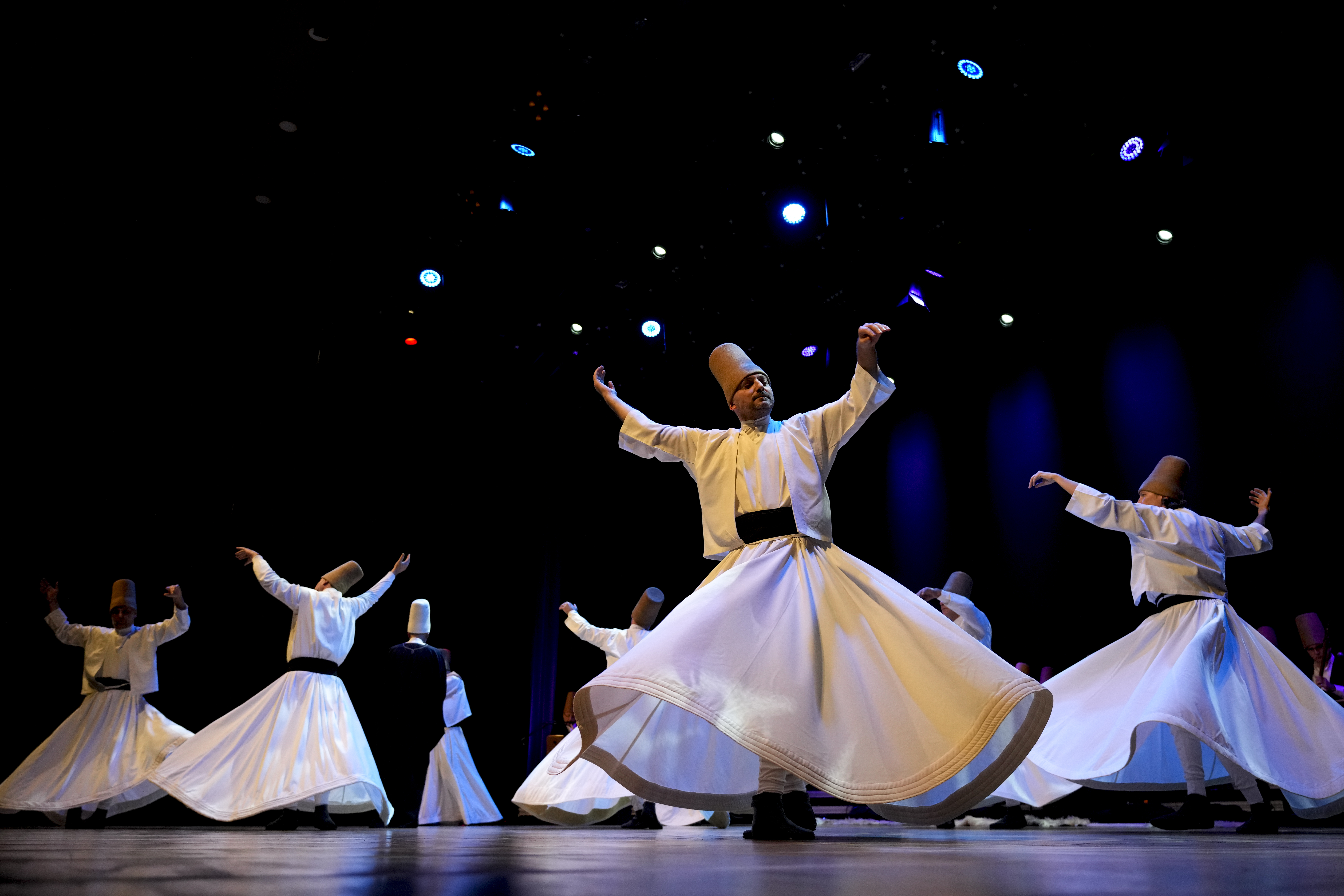 ISTANBUL — Celebrating a medieval Islamic scholar with dance: Whirling dervishes of the Mevlevi order perform during a Sheb-i Arus ceremony in Istanbul, Turkey, Sunday, Dec. 17, 2023. Every December a series of events are held to commemorate the death of 13th-century Islamic scholar, poet and Sufi mystic Jalaladdin Rumi in different cities of Turkey.Photo: Emrah Gurel/AP