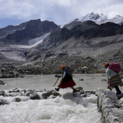 BOLIVIA — Female guides navigate high-melting ice: Suibel Gonzales, left, and her mother Lidia Huayllas, Aymara Indigenous women who make a living as mountain guides, walk on the Huayna Potosi glacier on the outskirts of El Alto, Bolivia, Sunday, Nov. 5, 2023. When they first started climbing the Andes peaks years ago, they could hear the ice crunching under their crampons. These days, it’s the sound of melted water running beneath their feet that they mostly listen to as they make their way up.Photo: Juan Karita/AP