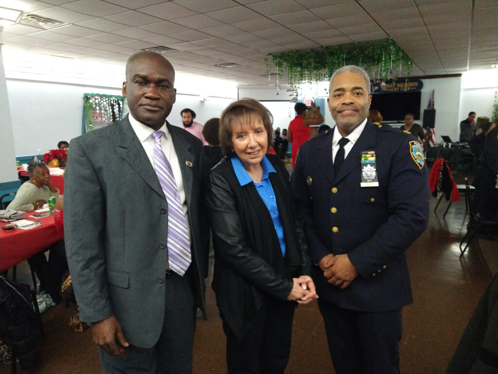 From left: Gardy Brazela, president of the 69th Precinct Community Council, and Capt. Dion Hinds (far right) at 69th Precinct Community Council.Photos: Arthur DeGaeta