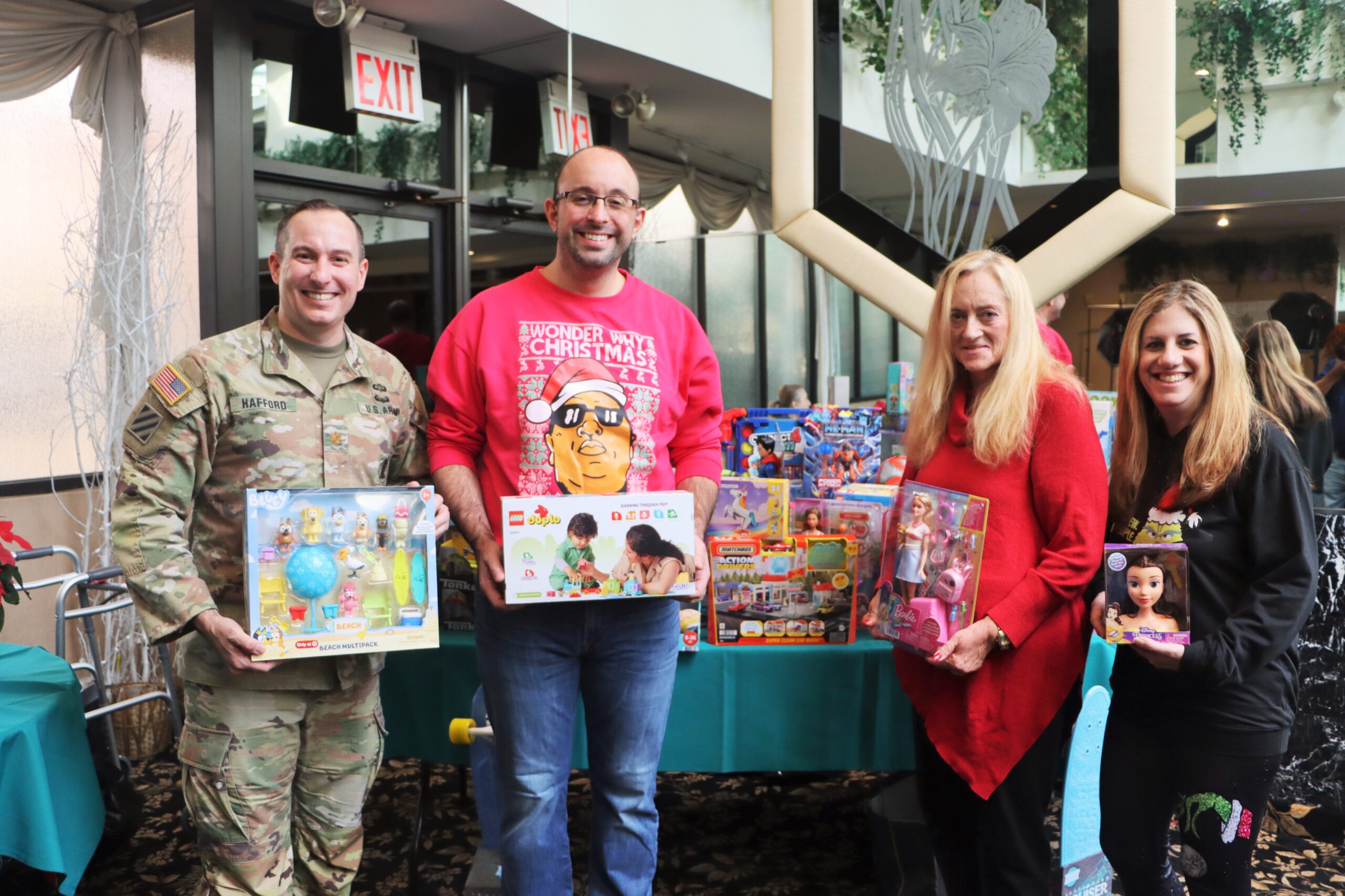 U.S. Army Maj. Roger Hafford, BRLA President Adam Kalish, Margaret Stanton, and Joann Monaco at the Breakfast with Santa event, showcasing the community's support for military families.Photos: Mario Belluomo/Brooklyn Eagle