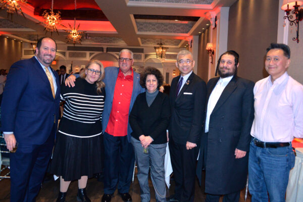 Fran Vella-Marrone, chairwoman, Kings County Conservative Party (center);
along with GOP party guests at GOP holiday party.