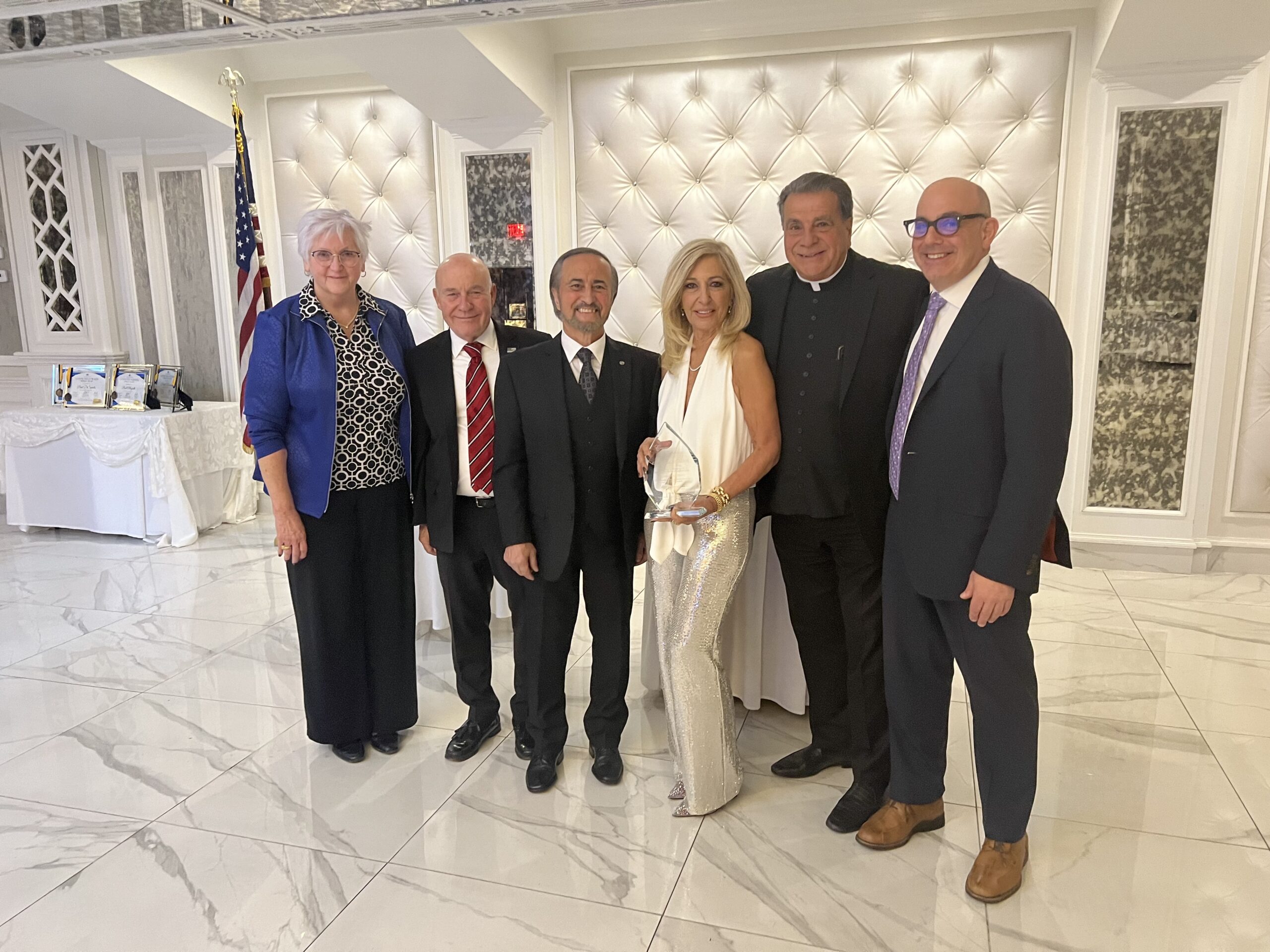 Hon. Patricia DiMango holding her award; and from left: Judy Bachman, executive vice president and COO, Maimonides; Brian Long; Frank Naccarato, co-chair of Community for Kids and board member/trustee of Maimonides Medical Center; Msgr. David Cassato, Maimonides trustee and vicar for education, Diocese of Brooklyn; and Dr. John Marshall, chair of the Department of Emergency Medicine and vice president for medical affairs at Maimonides at eighth annual Community for Kids Benefit.