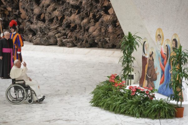 <b>VATICAN — Special tribute to a brightly colored sacred scene:</b> Pope Francis prays in front of a Nativity scene as he leaves the Paul VI hall at the end of his meeting with Vatican employees for the season greetings at the Vatican, Thursday, Dec. 21, 2023.<br>Photo: Gregorio Borgia/AP