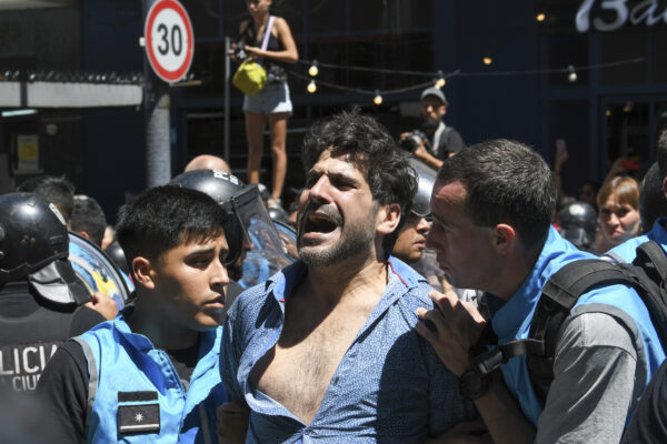 <b>BUENOS AIRES — Protesting allowed? Yes. Blocking streets? No:</b> Police detain a protester for blocking the streets during an anti-government demonstration against the economic reforms of President Javier Milei in Buenos Aires, Argentina, Wednesday, Dec. 27, 2023. Milei's government has warned it will not allow protesters to block streets.<br>Photo: Gustavo Garello/AP