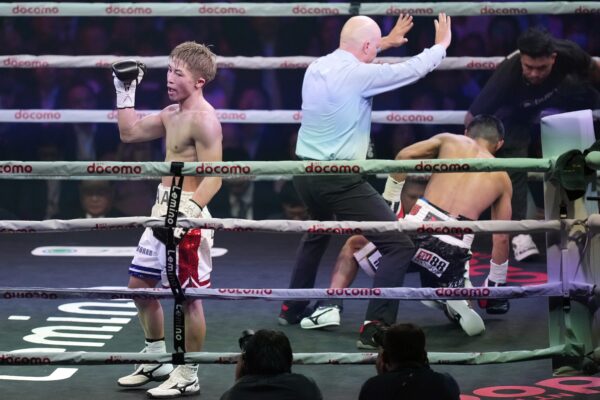 <b>TOKYO — Bantamweight boxing victory:</b> Naoya Inoue of Japan, left, celebrates after beating Marlon Tapales of the Philippines in the tenth round of a boxing match for the unified WBA, WBC, WBO and IBF super bantamweight world titles in Tokyo, Tuesday, Dec. 26, 2023.<br>Photo: Hiro Komae/AP