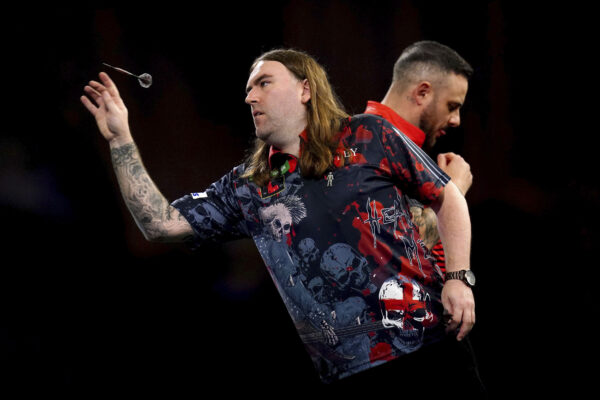 <b>LONDON — Freeze frame — the release of a world champion in darts:</b> England's Ryan Searle, left, is seen in action during his match against England's Joe Cullen, right, on day eleven of the Paddy Power World Darts Championship at Alexandra Palace, London, England, Thursday, Dec. 28, 2023.<br>Photo: John Walton/PA via AP