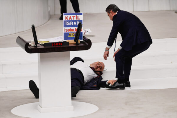 <b>ANKARA — Collapse, eventually fatal, in heated political atmosphere:</b> Hasan Bitmez, 53, a Turkish lawmaker from the Islamist Saadet Partisi, or Felicity Party, collapses after speaking at the main chamber of the Turkish parliament in Ankara, Thursday, Dec.14, 2023. Bitmez died in a hospital later. His collapse in parliament occurred just after delivering a speech critical of Israel and of the ruling party's relationship with the country.<br>Photo: Selahattin Sonmez/Dia Images via AP