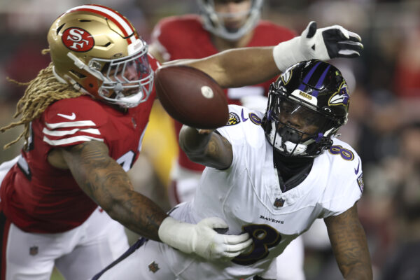 <b>CALIFORNIA — This is what they should call a ‘sack release’:</b> Baltimore Ravens quarterback Lamar Jackson, right, throws the ball while trying to avoid San Francisco 49ers defensive end Chase Young during the first half of an NFL football game in Santa Clara, Calif., Monday, Dec. 25, 2023. Jackson was called for intentional grounding in the end zone on the play, which scored a safety for the 49ers.<br>Photo: Jed Jacobsohn/AP