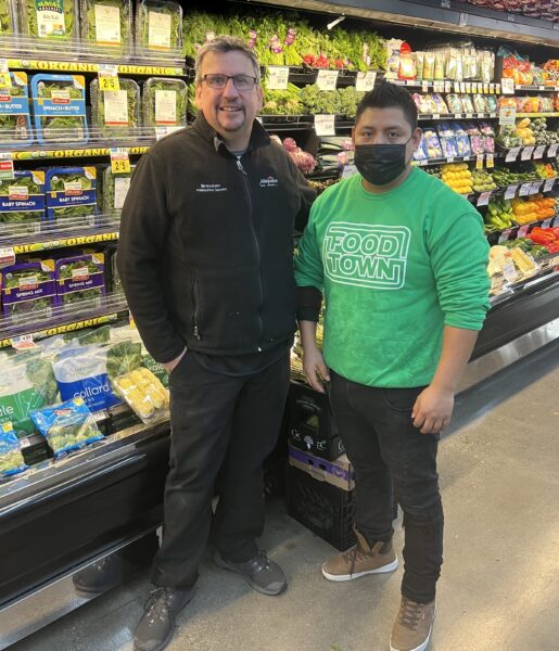 From left: Brendan Keating, produce field merchandiser, Allegiance; and produce manager Javier at Foodtown ribbon cutting.