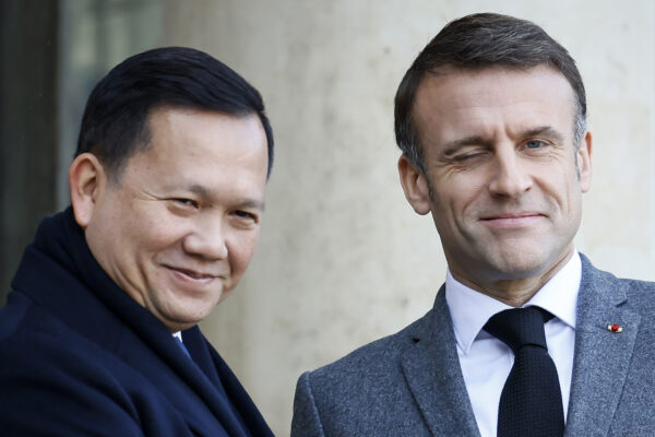 PARIS — Cultivating political and economic alliances: French President Emmanuel Macron winks as he welcomes Cambodia's Prime Minister Hun Manet on Thursday, Jan. 18, 2024, before a working lunch at the Elysee Palace in Paris.Photo: Thomas Padilla/AP