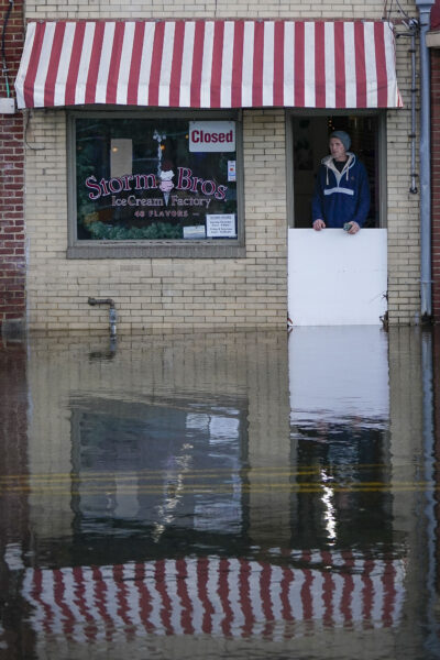 MARYLAND — Nature’s revenge wreaks havoc on ice cream shops: An employee of Storm Ice Cream Factory surveys damage after a winter storm left more than two feet of water inside many businesses in downtown Annapolis, MD, Wednesday, Jan 10, 2024.Photo: Bryan Woolston/AP