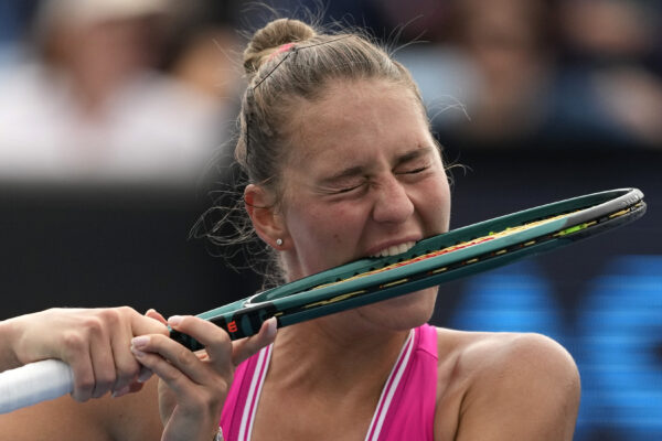 <b>MELBOURNE — Biting the racket in hopes of soon biting the gold:</b> Marta Kostyuk of Ukraine bites her racket during her third round match against Elina Avanesyan of Russia at the Australian Open tennis championships at Melbourne Park, Melbourne, Australia, Friday, Jan. 19, 2024.<br>Photo: Alessandra Tarantino/AP