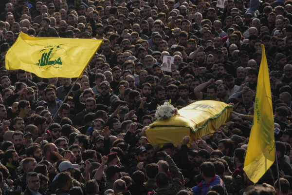 LEBANON — Laying a Hezbollah commander to rest: Mourners carry the coffin of senior Hezbollah commander Wissam Tawil during his funeral procession in the village of Khirbet Selm, south Lebanon, Tuesday, Jan. 9, 2024. The elite Hezbollah commander who was killed in an Israeli airstrike Monday in southern Lebanon fought for the group for decades and took part in some of its biggest battles.Photo: Hussein Malla/AP