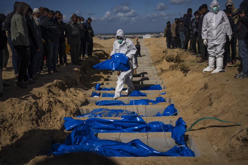 GAZA — More bodies than resolutions — mass gravesite in a daily overwhelming war: Palestinians bury the bodies of people who were killed in fighting with Israel and returned to Gaza by the Israeli military during a mass funeral in Rafah, Gaza Strip, Tuesday, Jan. 30, 2024.Photo: Fatima Shbair/AP
