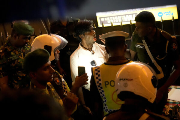 <b>SRI LANKA — ‘No drugs in here officer’:</b> Sri Lankan police officers detain and question a suspected drug offender during a search operation against narcotics in Colombo, Sri Lanka, Thursday, Jan. 18, 2024.<br>Photo: Eranga Jayawardena/AP