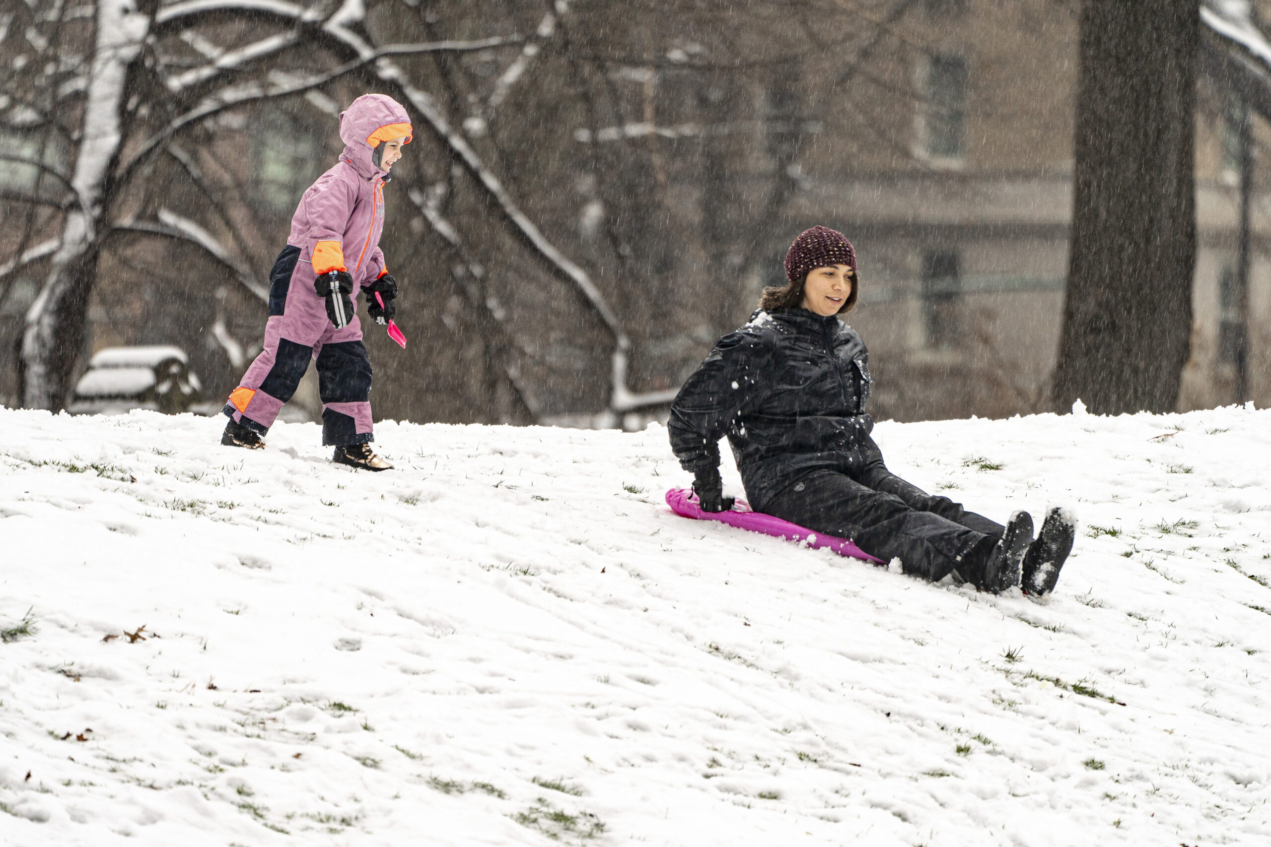 People play in the snow in Central Park