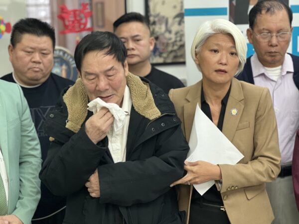 State Sen. Iwen Chu (right) attempts to console the victim’s husband, Wei Zhao.<br>Photo: Wayne Daren Schneiderman/Brooklyn Eagle