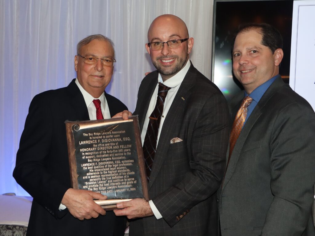 President Adam Kalish (center) and past president Stephen Chiaino (right) present Lawrence “Larry” DiGiovanna with a plaque commemorating him as the BRLA’s honorary director and fellow.Photos: Mario Belluomo/Brooklyn Eagle