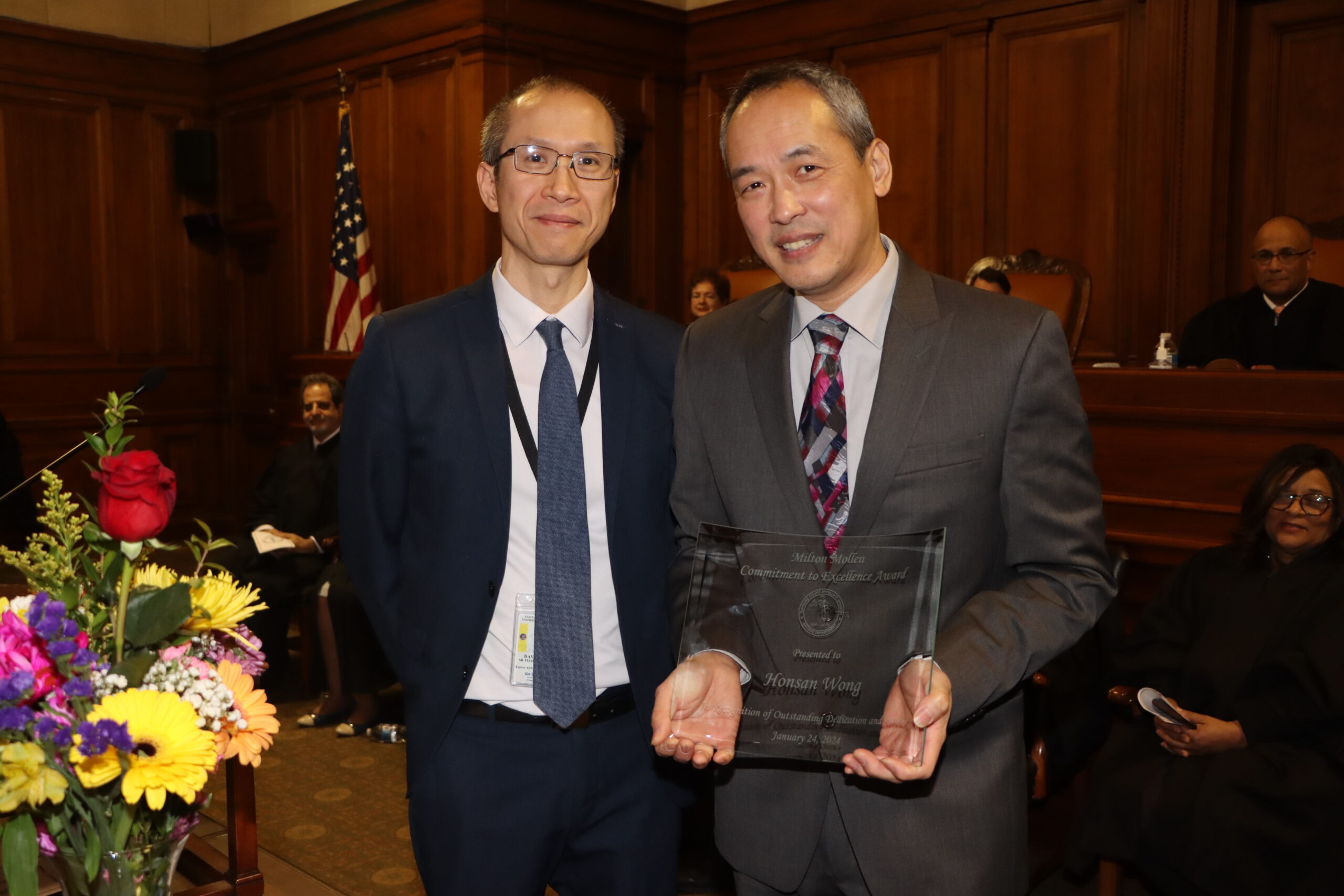 Honsan Wong (right), a senior management analyst from the Appellate Division, Second Department’s IT Department, was presented with the Mollen Award by David Lin (left), senior technical manager at Milton Mollen Commitment.
