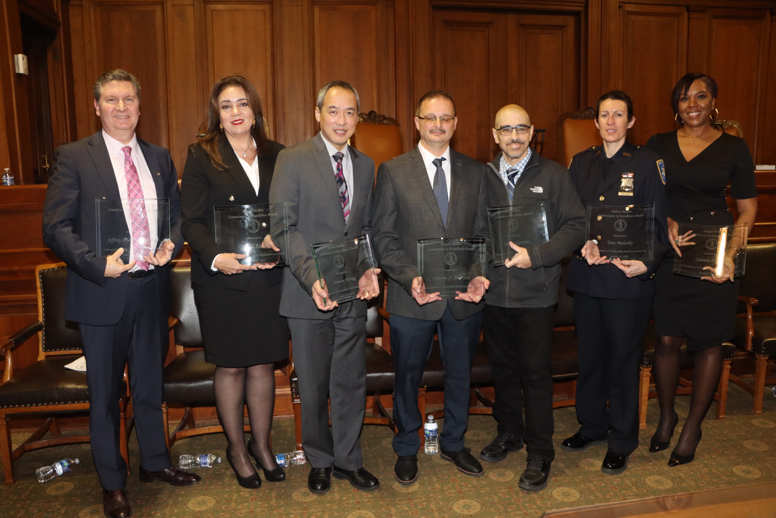 The 2024 Mollen Award honorees (pictured from left to right): Jeffrey Carpenter, Ana Kesler, Honsan Wong, Vincent DeRosa, Alberto Figueroa, C.O. Tara Mulcahy, and Tamara Broadus. Not pictured is Phyllis Carusillo, court analyst from the Appellate Division, Ancillary Agency of the Grievance Committee for the Tenth Judicial District at Milton Mollen Commitment.