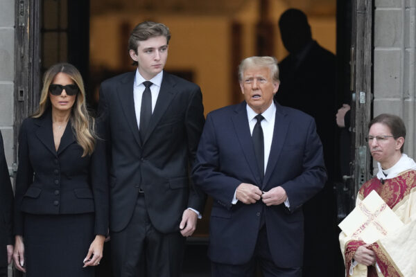 PALM BEACH — A side of Trump not often seen — attending grief and tending the new dynasty: Donald Trump, center right, stands with his wife Melania, left, and their son Barron, center left, outside the Church of Bethesda-by-the-Sea at the start of a funeral for Amalija Knavs, the former first lady's mother, in Palm Beach, FL, Thursday, Jan. 18, 2024.Photo: Rebecca Blackwell/AP