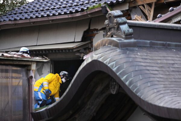 <b>JAPAN — Looking for survivors… and victims:</b> Police officers go into a building at the premises of a temple to search for victims in Wajima in the Noto peninsula, facing the Sea of Japan, northwest of Tokyo, Saturday, Jan. 6, 2024, following Monday's deadly earthquake.<br>Photo: Hiro Komae/AP