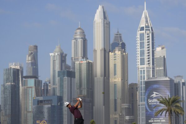 DUBAI — Golf course in the shadow of a downtown: Adrian Meronk of Poland plays his second shot on the 13th hole during the first round of the Hero Dubai Desert Classic golf tournament in Dubai, United Arab Emirates, Thursday, Jan. 18, 2024.Photo: Kamran Jebreili/AP
