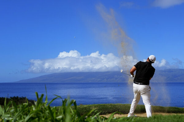 <b>HAWAII — This is called ‘blasting out of a sand trap’:</b> Byeong Hun An hits from the bunker along the 12th fairway during the final round of The Sentry golf event, Sunday, Jan. 7, 2024, at Kapalua Plantation Course in Kapalua, Hawaii.<br>Photo: Matt York/AP