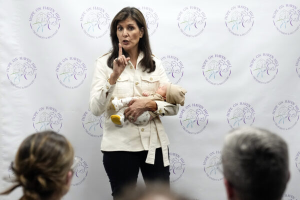 ROCHESTER, NH — Holding forth while holding a New Hampshire baby: Republican presidential candidate former UN Ambassador Nikki Haley holds a patient's baby while speaking at Hope on Haven Hill, a wellness center, Wednesday, Jan. 17, 2024, in Rochester, NH.Photo: Robert F. Bukaty/AP