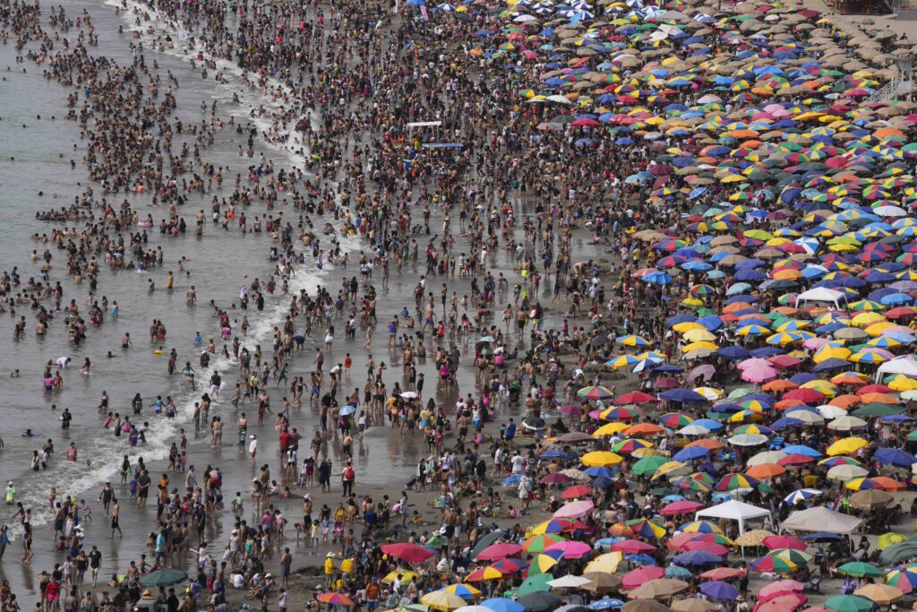 LIMA — Where’s Waldo? Look for the striped umbrella: Beachgoers crowd the Agua Dulce beach in Lima, Peru, on Sunday, Jan. 28, 2024.Photo: Martin Mejia/AP