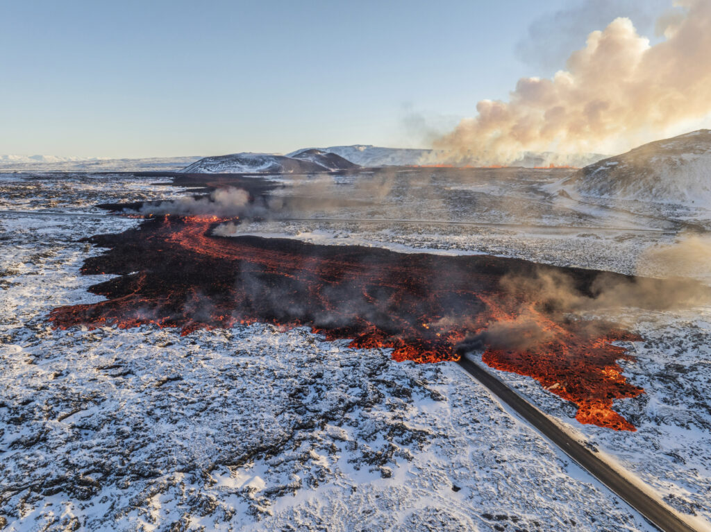 GRINDAVÍK — When the earth’s core is close to the surface: A view of lava crossing the main road to Grindavík and flowing on the road leading to the Blue Lagoon, in Grindavík, Iceland, Thursday, Feb. 8, 2024. A volcano in southwestern Iceland has erupted for the third time since December and sent jets of lava into the sky. The eruption on Thursday morning triggered the evacuation of the Blue Lagoon spa, which is one of the island nation’s biggest tourist attractions.Photo: Marco Di Marco/AP