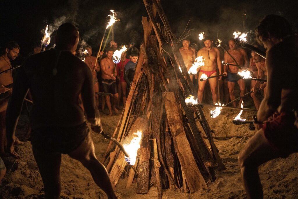 MAR AZUL — Bonfire with a purpose: Lifeguards start a bonfire with torches commemorating Lifeguard Day to honor their commitment to safety and aquatic rescue in Mar Azul, Argentina, on Wednesday, Feb. 14, 2024.Photo: Rodrigo Abd/AP