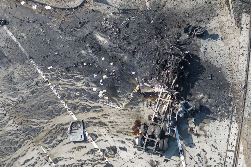 <b>LOS ANGELES — Goodness gracious, great balls of fire!</b> The tractor portion of a big rig is shown in an aerial view on Thursday, Feb. 15, 2024, in the Wilmington section of Los Angeles. Several Los Angeles firefighters were injured, two critically, when an explosion occurred as they responded to a truck with pressurized cylinders that were on fire early Thursday, authorities said.<br>Photo: William Liang/AP
