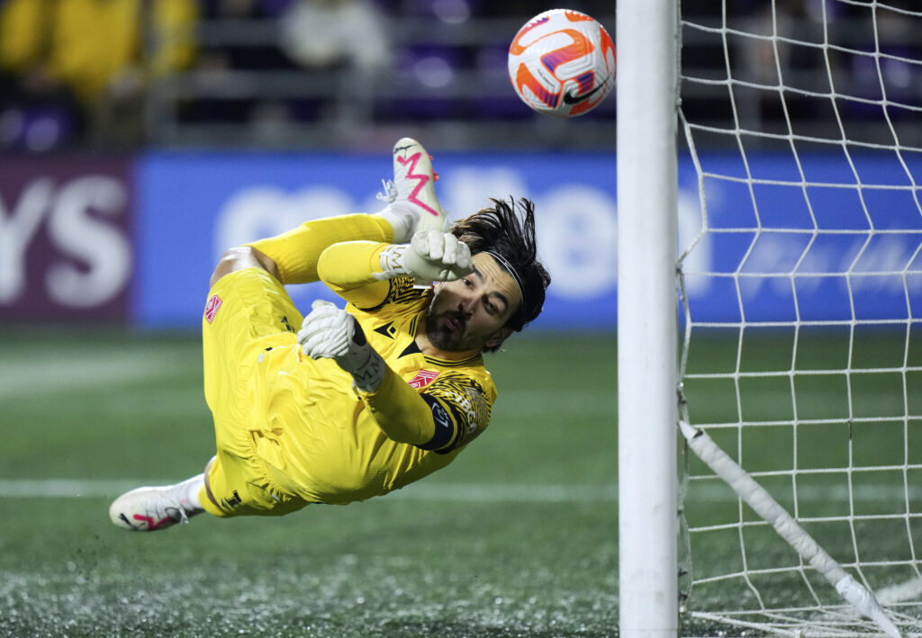 BRITISH COLUMBIA — Going airborne against the ball and losing: Cavalry FC goalkeeper Marco Carducci allows a goal to Orlando City's Facundo Torres, not seen, during the first half of a CONCACAF Champions Cup soccer match in Langford, British Columbia, Wednesday, Feb. 21, 2024.Photo: Darryl Dyck/The Canadian Press via AP