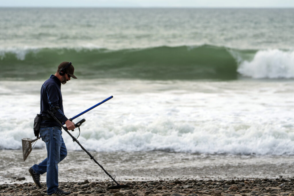 CALIFORNIA — Seeking treasures ahead of the storm: Josh Snider searches for metals with a metal detector on the edge of the beach ahead of storms, Wednesday, Jan. 31, 2024, in Ventura, CA. The first of two back-to-back atmospheric rivers slowly pushed into California on Wednesday, triggering statewide storm preparations and calls for people to get ready for potential flooding, heavy snow and damaging winds.Photo: Damian Dovarganes/AP