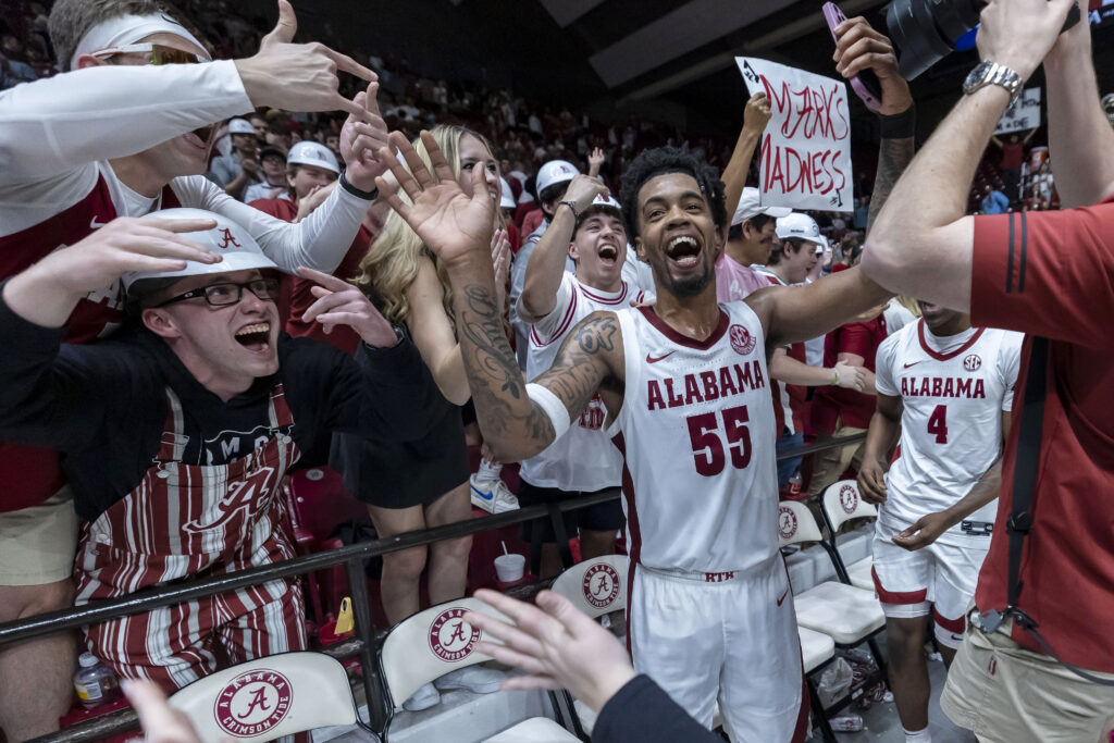 ALABAMA — With all the grim sadness in the world, it’s good to see sports bringing joy: Alabama guard Aaron Estrada (55) celebrates with fans after the team's win over Florida in overtime in an NCAA college basketball game Wednesday, Feb. 21, 2024, in Tuscaloosa, AL.Photo: Vasha Hunt/AP