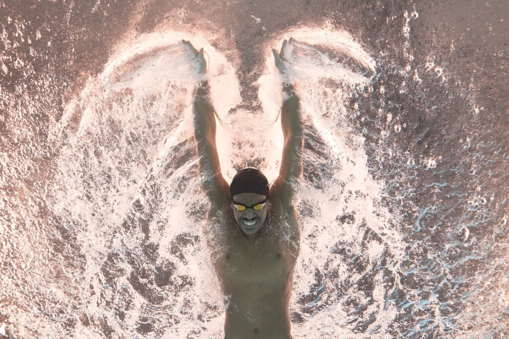 QATAR — Smiling for the camera: ​​Al Kulaibi Mskm of Oman competes in the men's 100-meter butterfly heat at the World Aquatics Championships in Doha, Qatar, Friday, Feb. 16, 2024.Photo: Lee Jin-man/AP